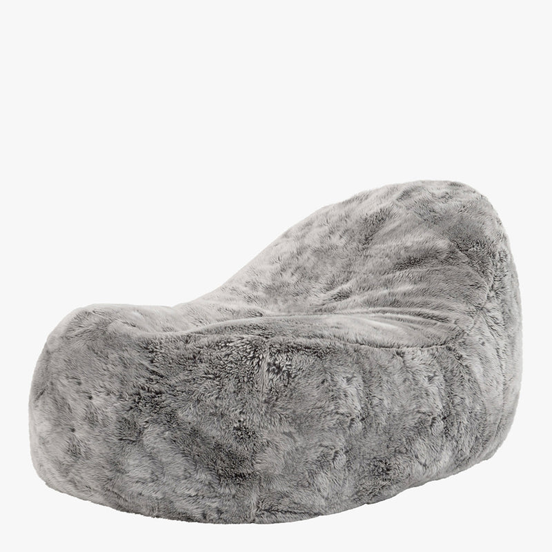 Fauteuil en fausse fourrure, gris loup de l'Arctique